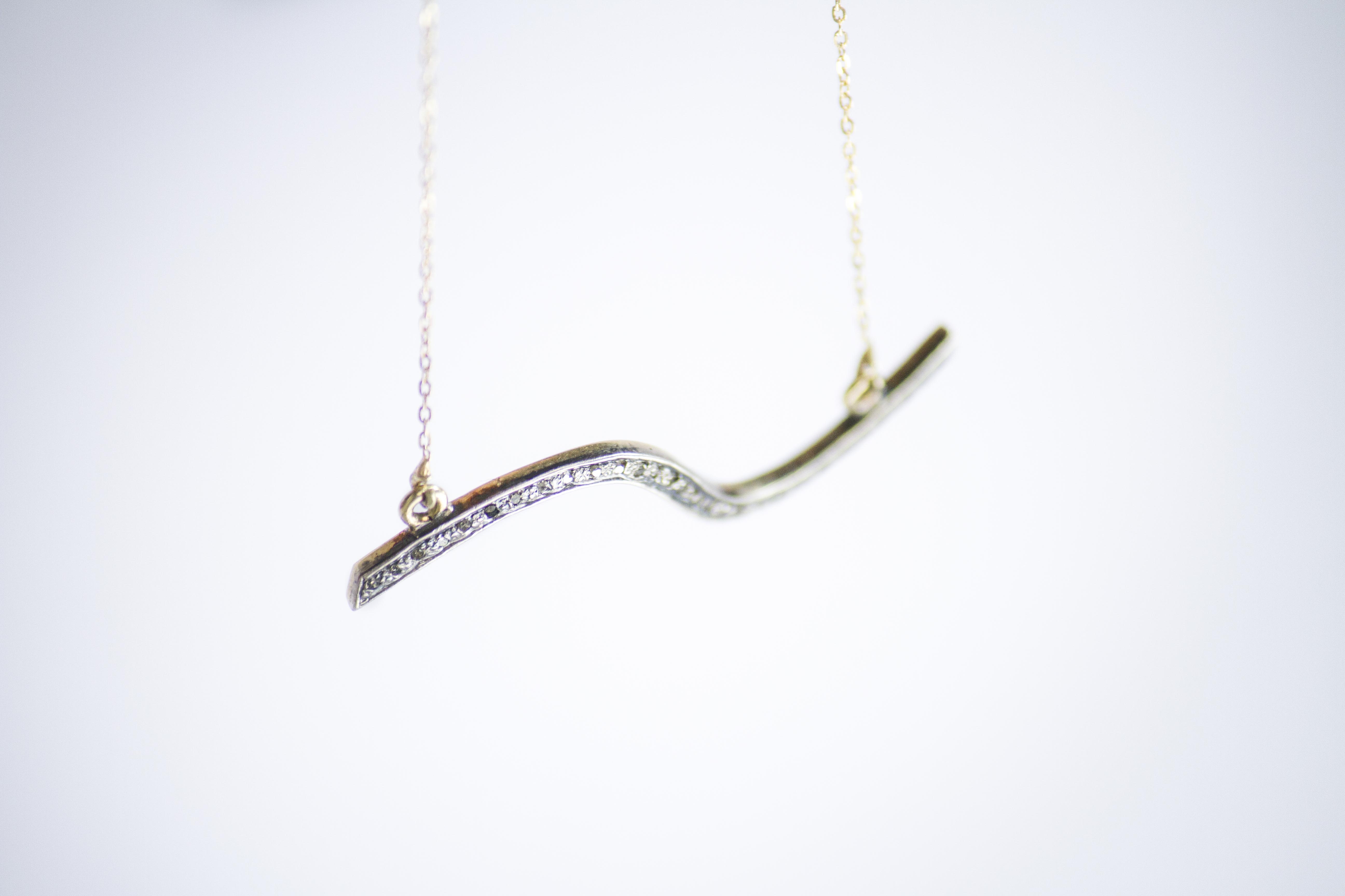 wave necklace Delicate pendant crafted with 14k yellow with diamond pave and a fine chain